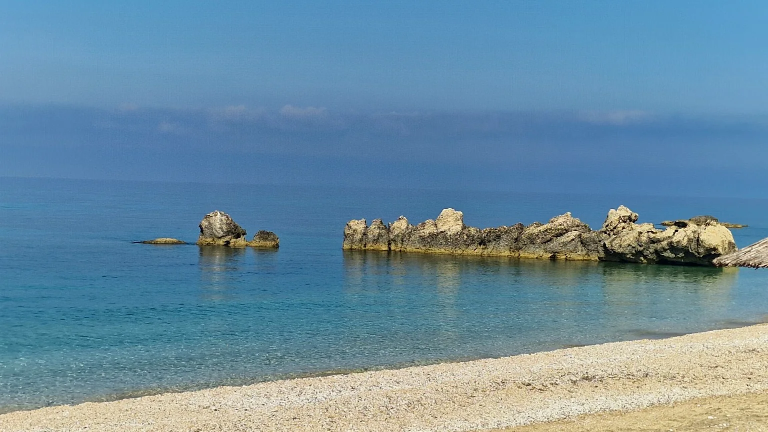 Clear Ionian Sea and distinctive rocks at the beach near Villa Vanda in Lygia